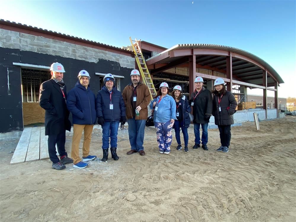 Board Trustees and Dr. Rogers pose outside the newly constructed fitness center